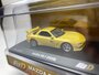 Kyosho 1:64 Mazda RX7 (FD3S) geel 1985 ​​​​​​​Initial D incl. vitrine – Circuit Wolf Blister pack edition_
